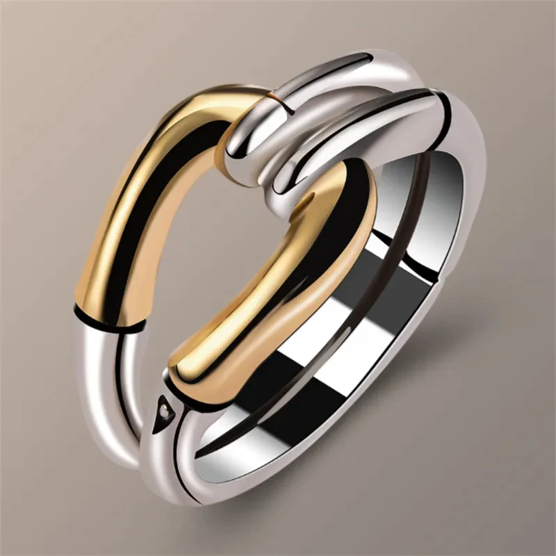 Eleganter Vintage-Ring mit einem faszinierenden Knotendesign aus gold- und silberfarbenem Metall
