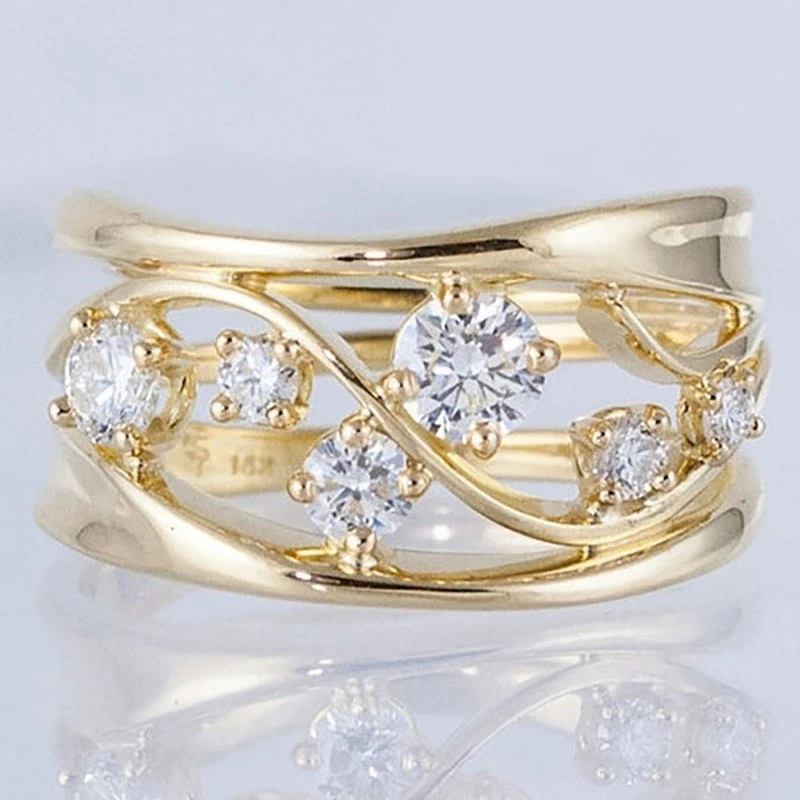 Stylish gold-plated ring with sparkling zirconia stones