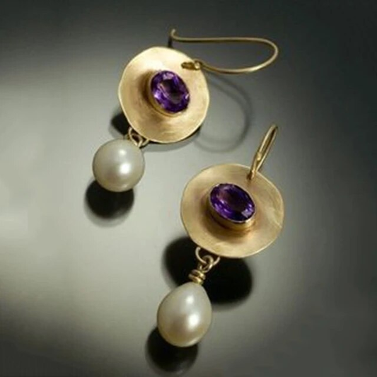 Fascinating pearl earrings with glowing purple zirconia